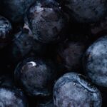 Plant-Based Diet - Top view of delicious sweet and fresh ripe blueberries placed on even surface
