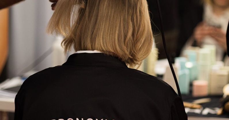 Haircuts - A woman is getting her hair done at a salon