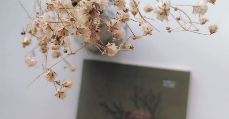 Dry Scalp - Notebook and Dried Flowers on a Table