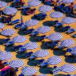 Heat Styling - Aerial View of Blue and White Open Cottages at the Beach