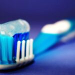 Brushing - Closeup and Selective Focus Photography of Toothbrush With Toothpaste
