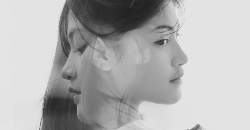 Layering - Black and White Double Exposure Portrait of a Young Beautiful Woman