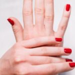 Beauty Tools - Person With Red Nail Polish