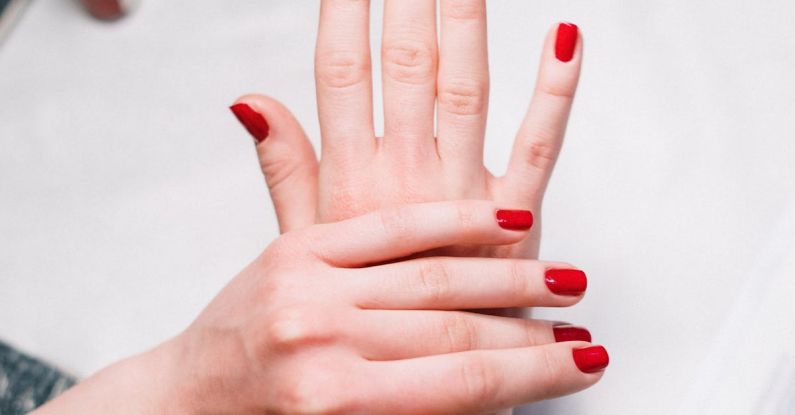 Beauty Tools - Person With Red Nail Polish