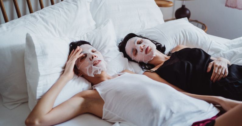 Facial Masks - Two Women Relaxing in Bed