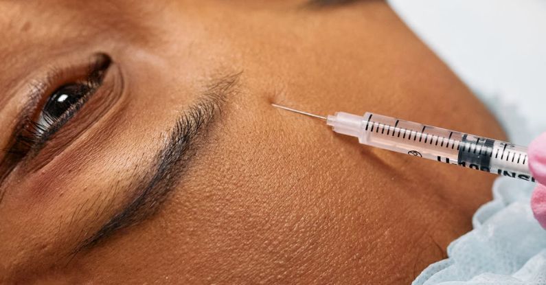 Anti-Aging Treatments - Injecting Person's Forehead