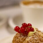 Mindful Eating - Closeup of a Macaroon Cake with Redberries, on a Table